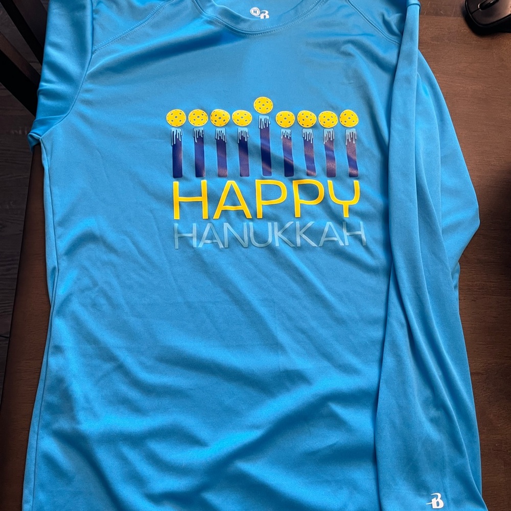 Hanukkah menorah with pickleball candles.  Perfect for Jewish pickleball friends